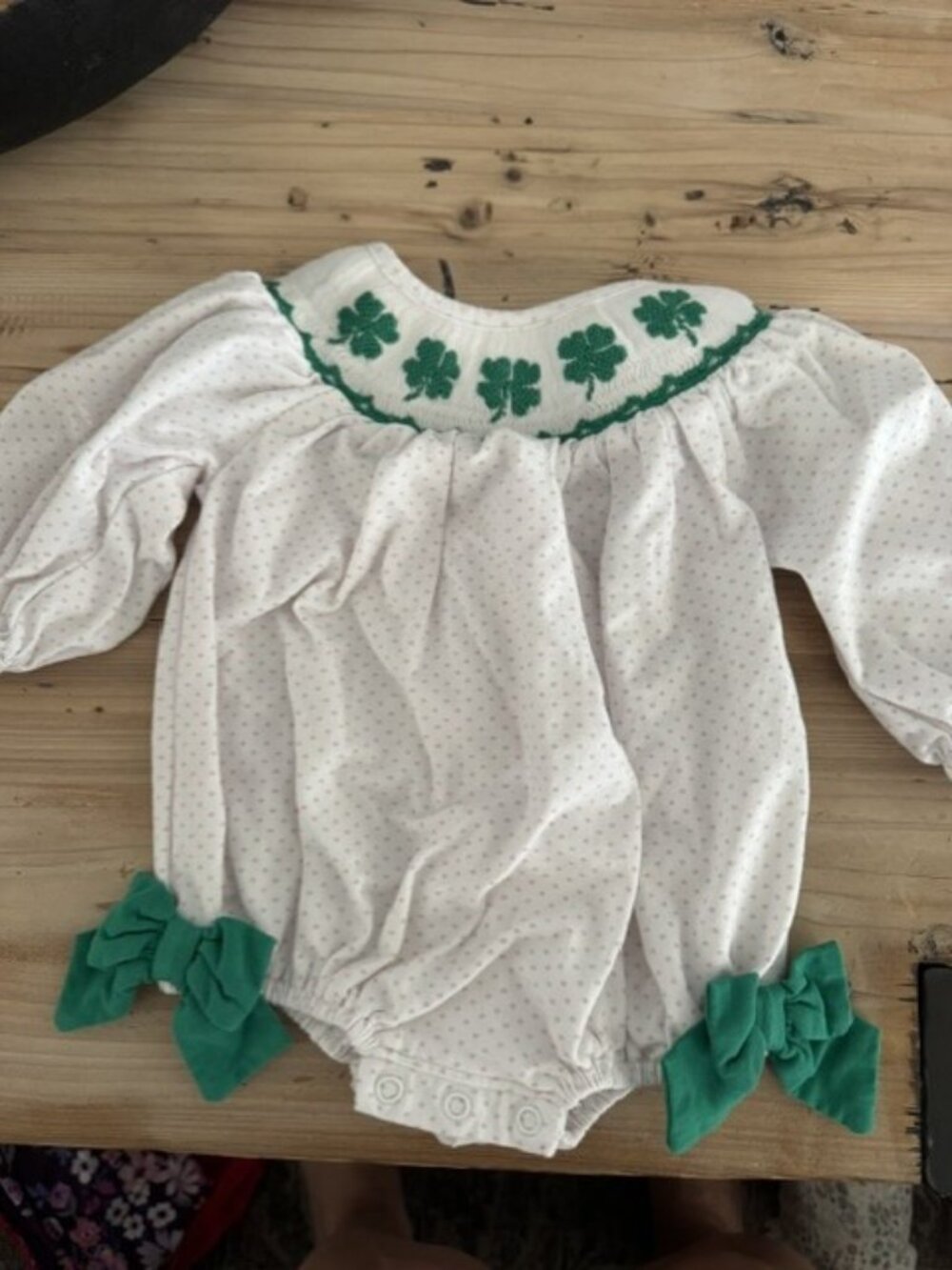 The Smocked Flamingo Smocked Shamrock Bubble. Size 0-3 months